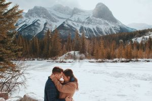 man hugging woman outdoors